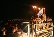 Sderot residents light Chanukah menorah made of Gaza rockets